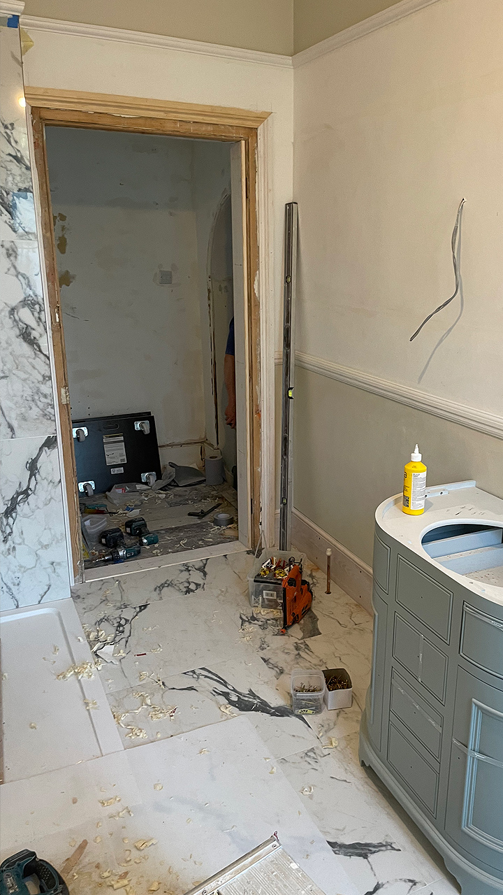 Pic showing the main bathroom looking back towards the door during remodelling